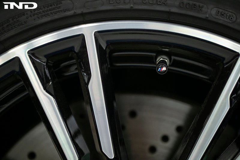 BMW OEM m logo black valve stem cap set - iND Distribution