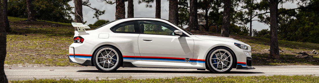 Trevora BMW G87 M2 carbon fiber aero kit front angle with pre-preg gloss carbon components installed