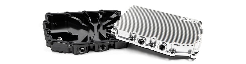 MMX Performance aluminum BMW DCT oil pan installed underside showing billet construction and cooling fins