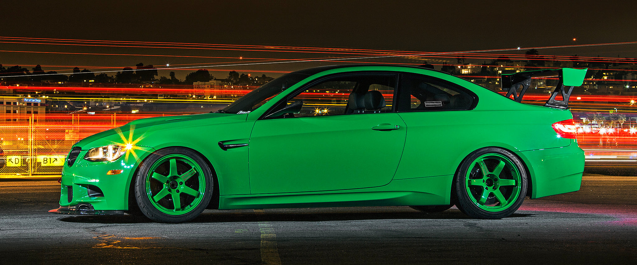 BMW Individual Signal Green E92 M3 side profile photographed at night with motorsport-inspired styling upgrades