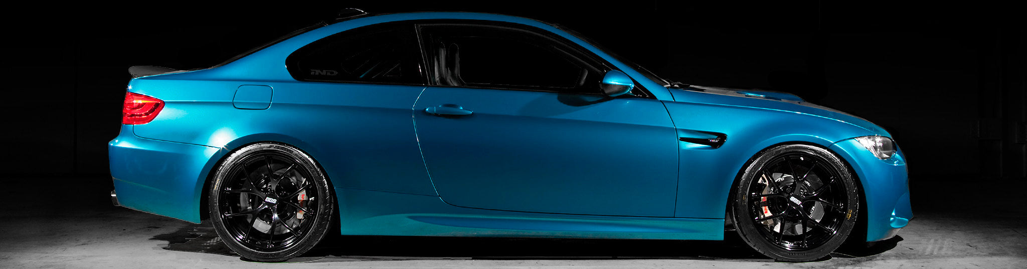 Atlantis Blue BMW E92 M3 side profile with BBS FI wheels and motorsport-inspired styling upgrades