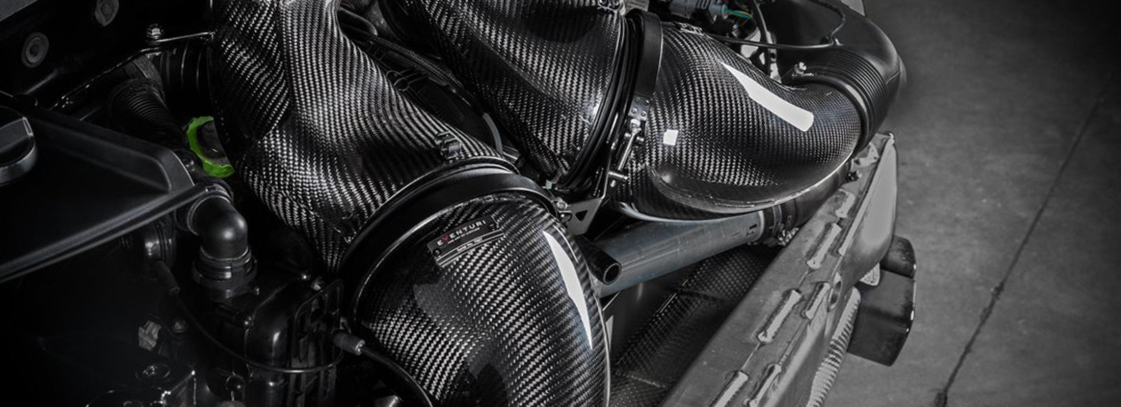 Top view of Eventuri 991 / 911 Turbo carbon intake installed in engine bay