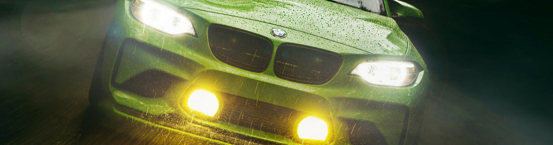 Gelbgrün BMW F87 M2 rolling through rain with M235R fog lights illuminated and BMW Motorsport-inspired aero upgrades