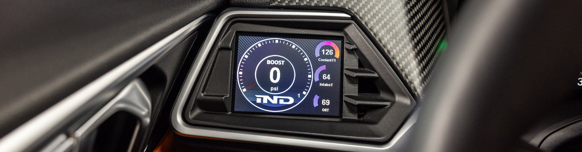 Automotive electronics display from CANchecked installed in a BMW G82 M4 featuring live vehicle diagnostics, sensor data monitoring, and CAN bus functionality.