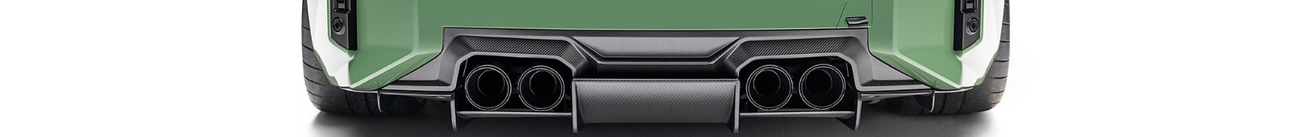 Green BMW M2 carbon fiber rear diffuser with quad exhaust tips