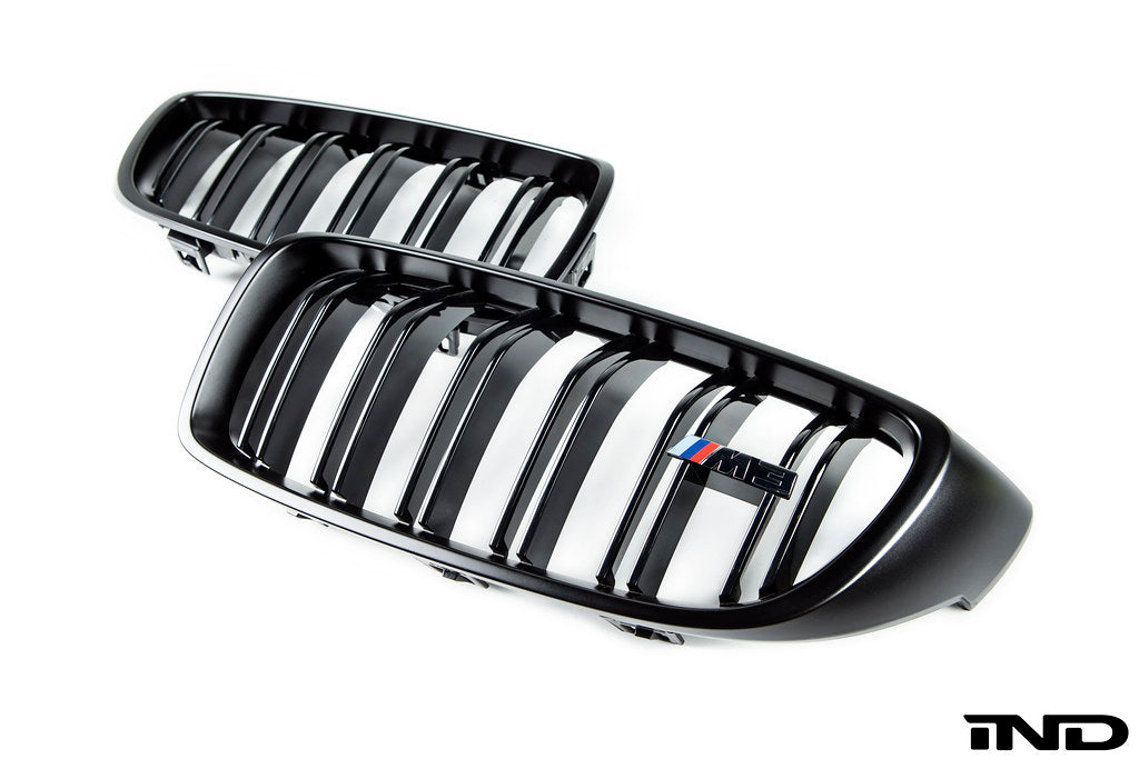 BMW F8X M3 M4 Competition front grille set by IND, showing sleek exterior grille with black finish and sporty design details.