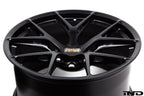 BBS 9J1 Taycan FI-R 21-inch wheel set with multi-spoke design on a car, showcasing sleek black finish and alloy construction.