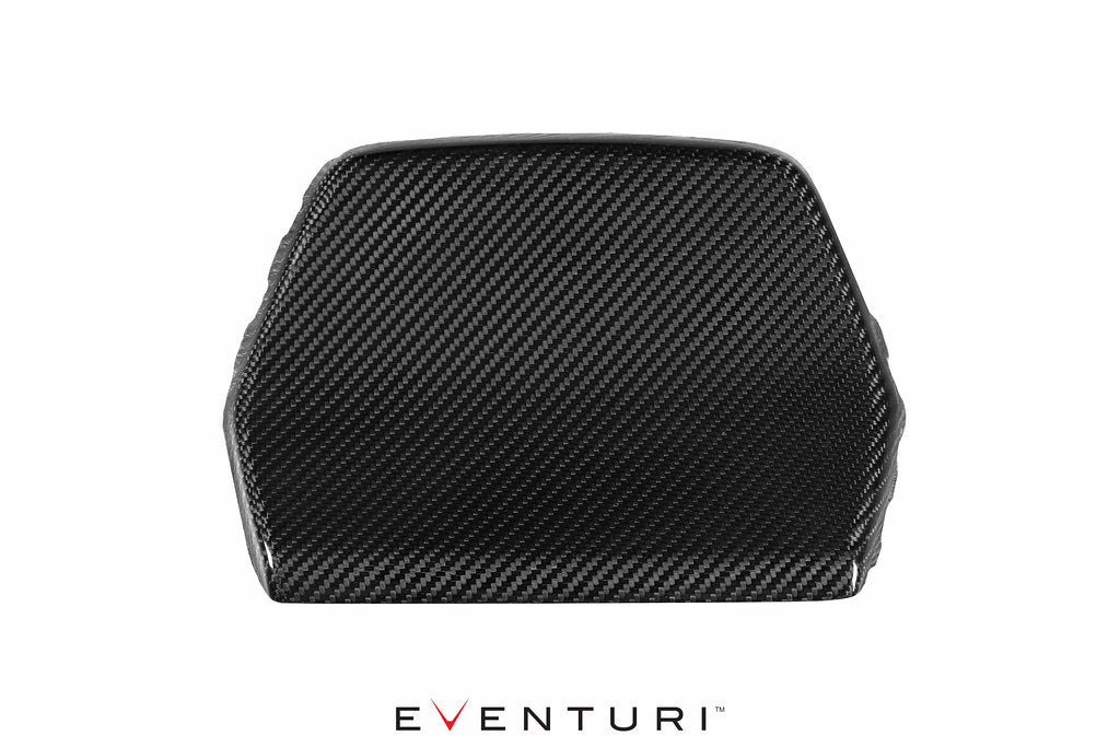 Eventuri black carbon seat back cover set installed in BMW F80 M3 and F82 M4 interior, showcasing sleek, high-quality carbon fiber material.