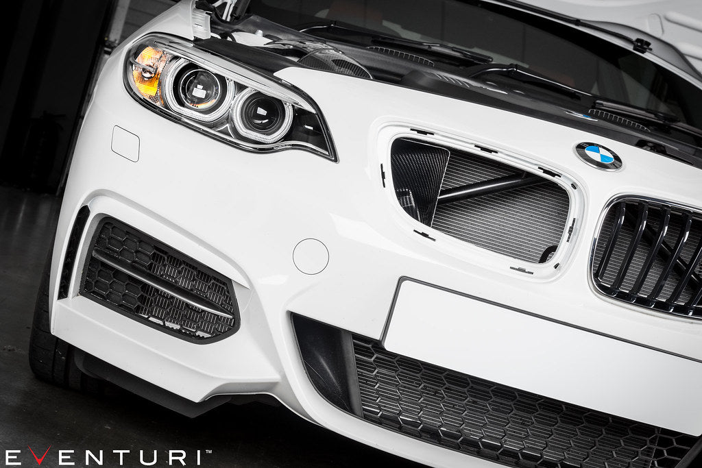 Eventuri black carbon intake system installed on BMW F-Chassis B58 engine, highlighting sleek performance upgrade and high-quality materials.