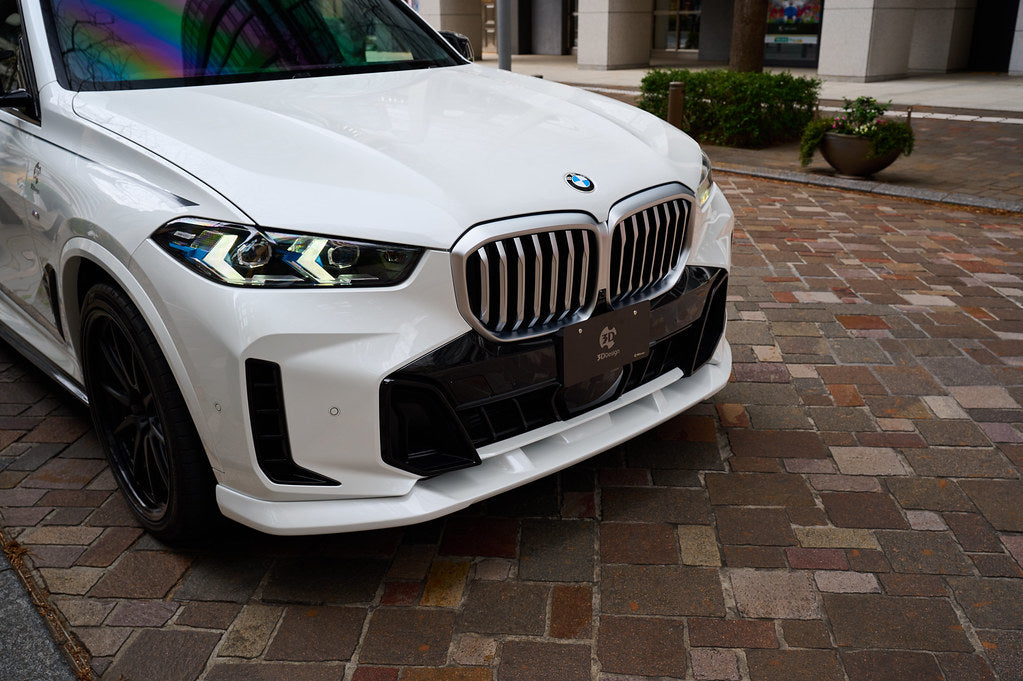 3D Design BMW G05 X5 LCI M Sport front lip spoiler installed on exterior of vehicle, showcasing sleek aerodynamic design.