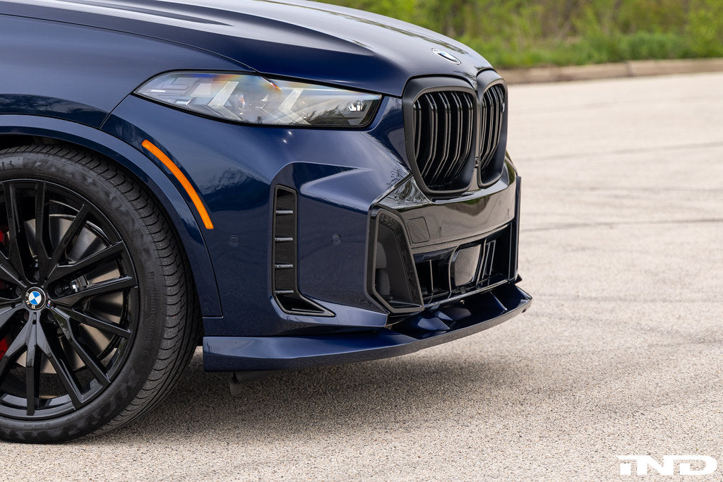 Painted 3D Design G05 X5 LCI front lip spoiler installed on vehicle exterior, showcasing sleek aerodynamic design.