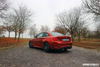 Eisenmann F87 M2 Competition performance exhaust with valves, showcasing a sleek black exhaust system on a car.