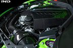 Black carbon engine cover for BMW F87 M2 N55 by Eventuri, exterior view showing sleek design and branding details.