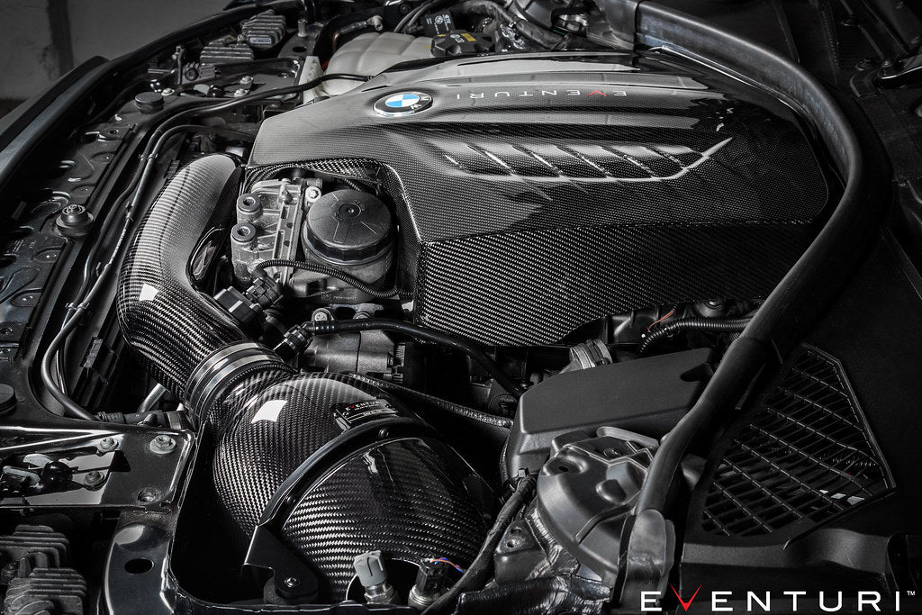 Eventuri black carbon engine cover for BMW F-Chassis N55, performance car engine component with sleek finish.