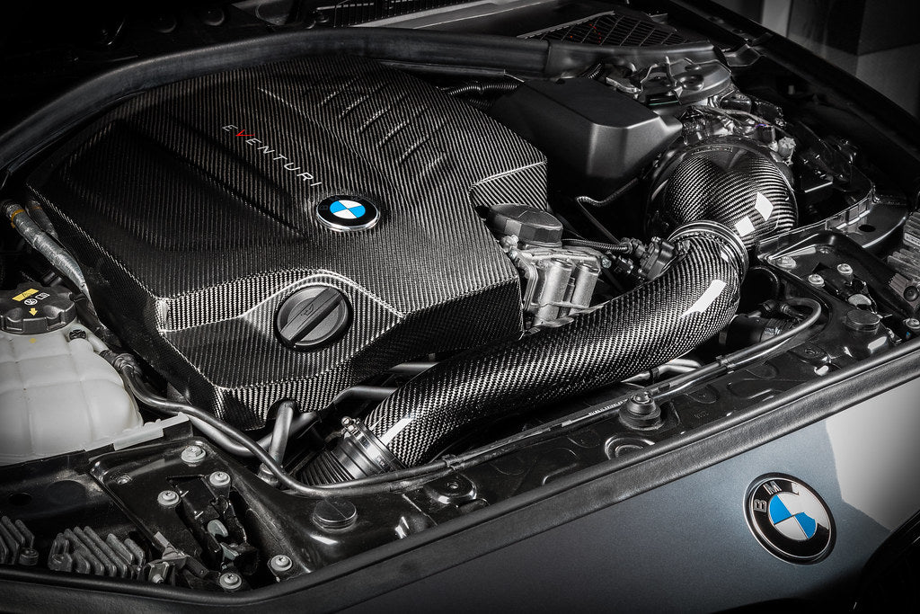 Eventuri black carbon engine cover for BMW F-Chassis N55 performance upgrade, showcasing sleek, high-quality engine protection.