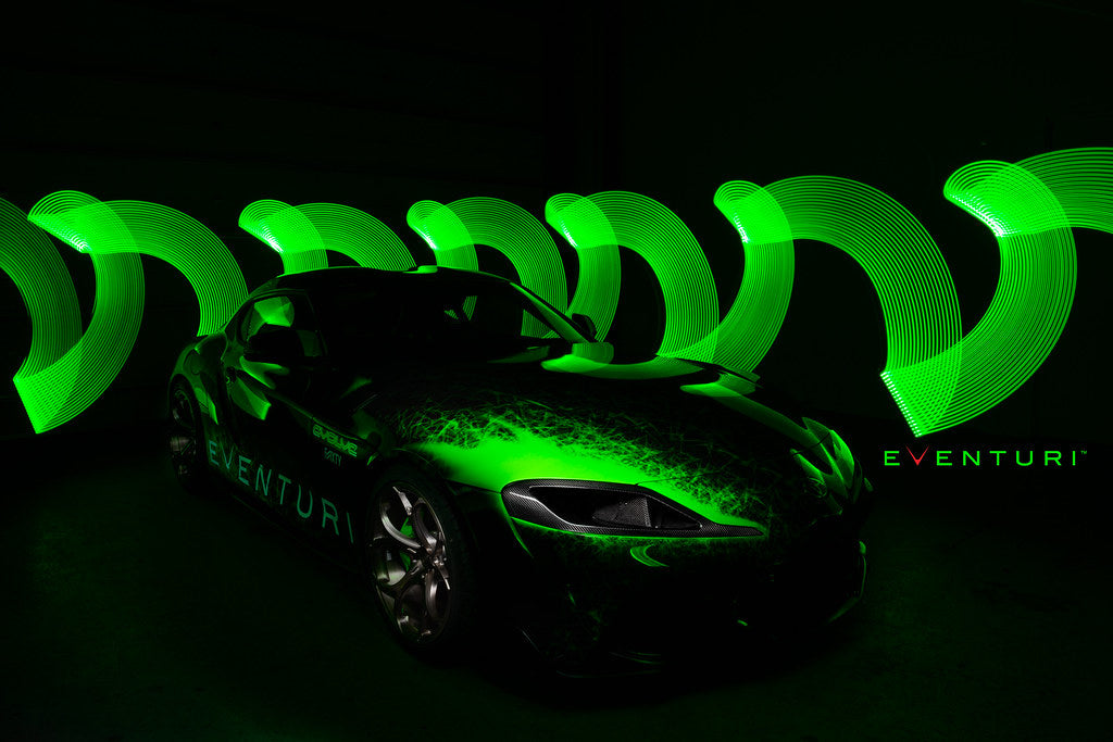 Eventuri black carbon headlamp race duct for Toyota A90 Supra, showcasing sleek design and performance-focused features.