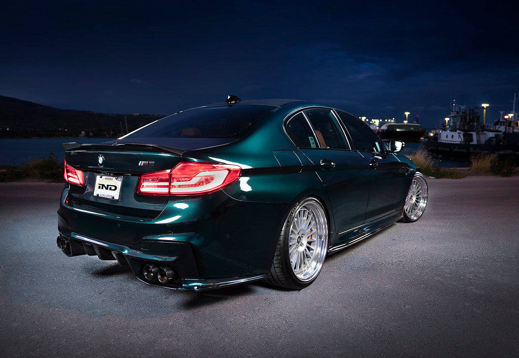 Eisenmann F90 M5 performance exhaust system with valves, showcasing polished metal exhaust tips and piping.