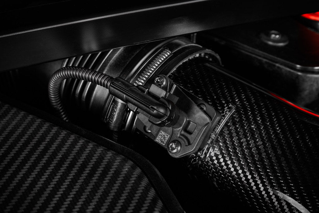 Eventuri black carbon intake system for BMW F4X M135i, M235i, F39 X2 35i B48 performance engine upgrade, shown installed.