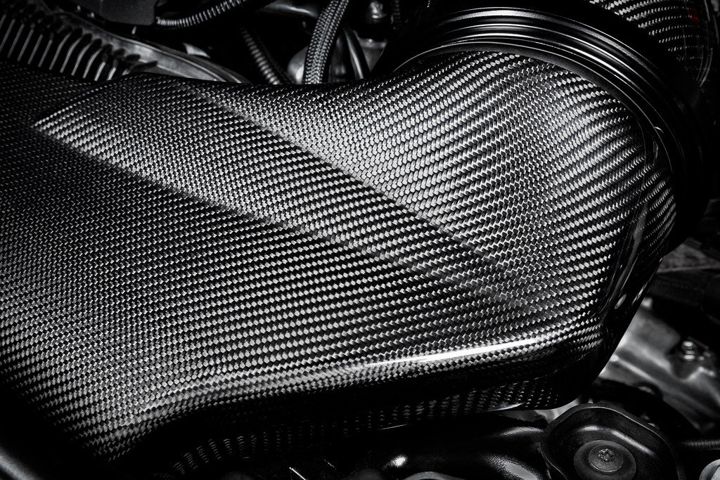 Eventuri black carbon intake system for BMW F4X M135i M235i and F39 X2 35i B48 performance engine, shown in the image.