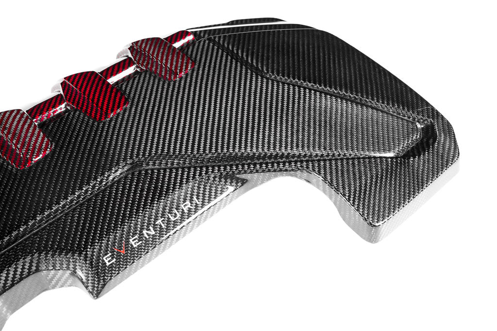Eventuri black carbon and red kevlar engine cover on Audi 8Y/8V RS3 and TTRS, exterior view showcasing sleek design.