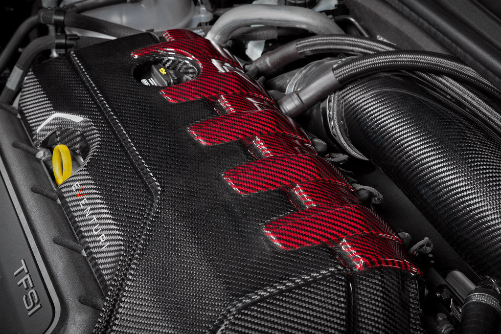 Eventuri black carbon and red kevlar engine cover for Audi 8Y/8V RS3 and TTRS, exterior view showing sleek design details.