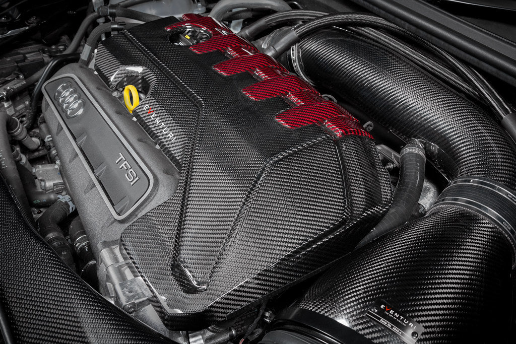 Eventuri Audi RS3 TTRS black carbon and red Kevlar engine cover exterior view, showcasing sleek and sporty design details.