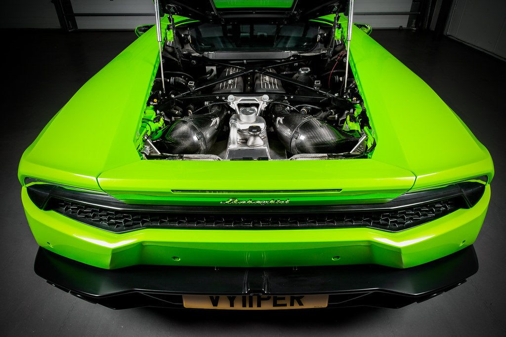 Eventuri Lamborghini Huracan V10 black carbon intake system showing sleek carbon fiber design and performance-enhancing components.