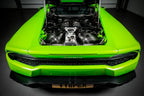 Eventuri Lamborghini Huracan V10 black carbon intake system showing sleek carbon fiber design and performance-enhancing components.