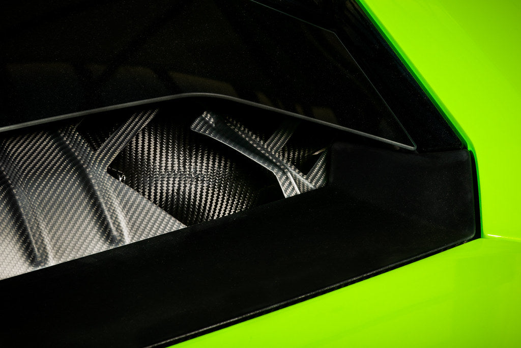 Eventuri Lamborghini Huracan V10 black carbon intake system showing sleek performance air intake with carbon fiber finish