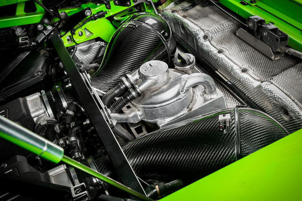 Eventuri Lamborghini Huracan V10 black carbon intake system with high-performance air filters and sleek design.