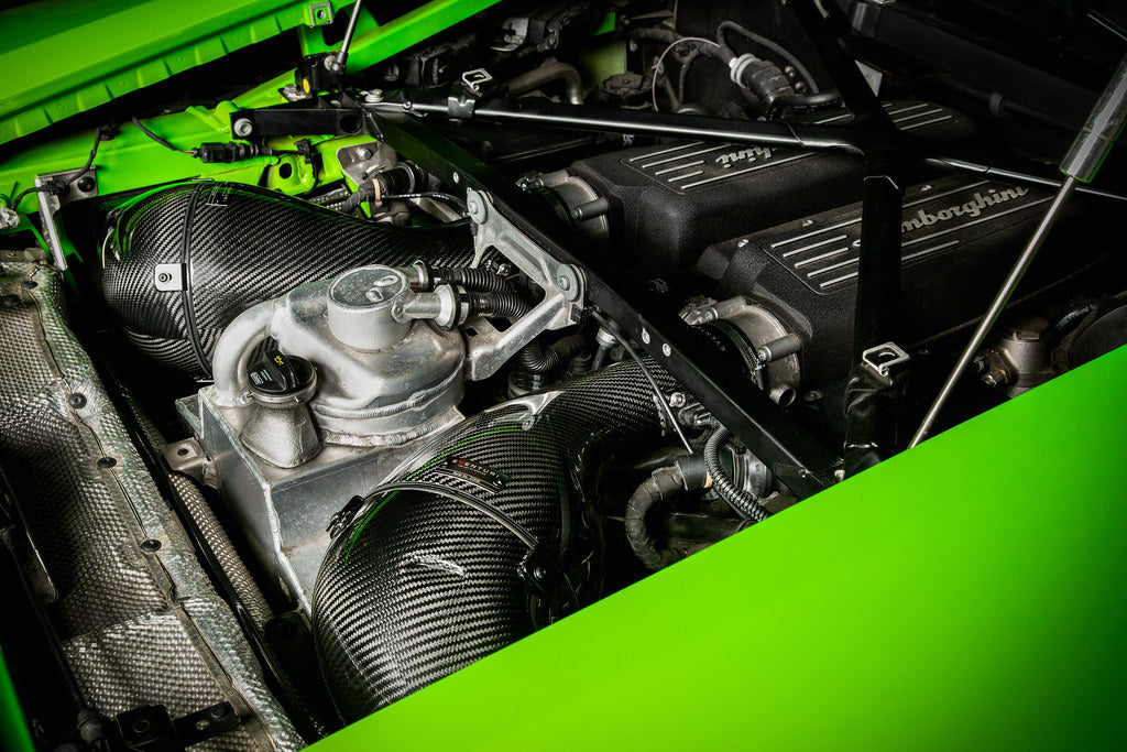 Eventuri Lamborghini Huracan V10 black carbon intake system showcasing sleek performance air intake components.