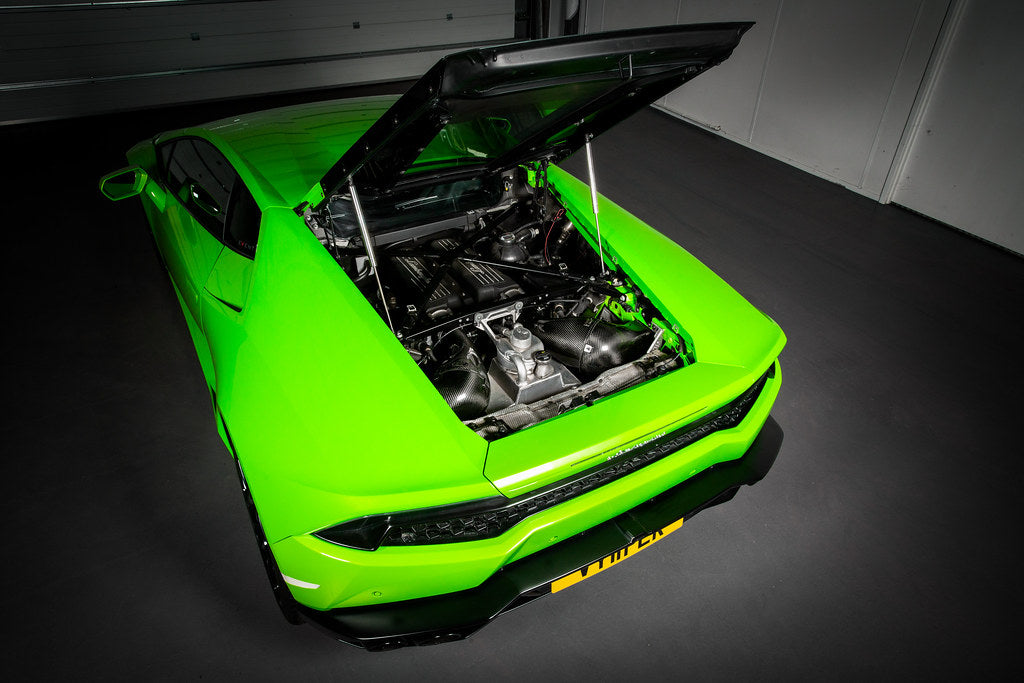 Eventuri Lamborghini Huracan V10 black carbon intake system with sleek design and performance parts visible in the image.
