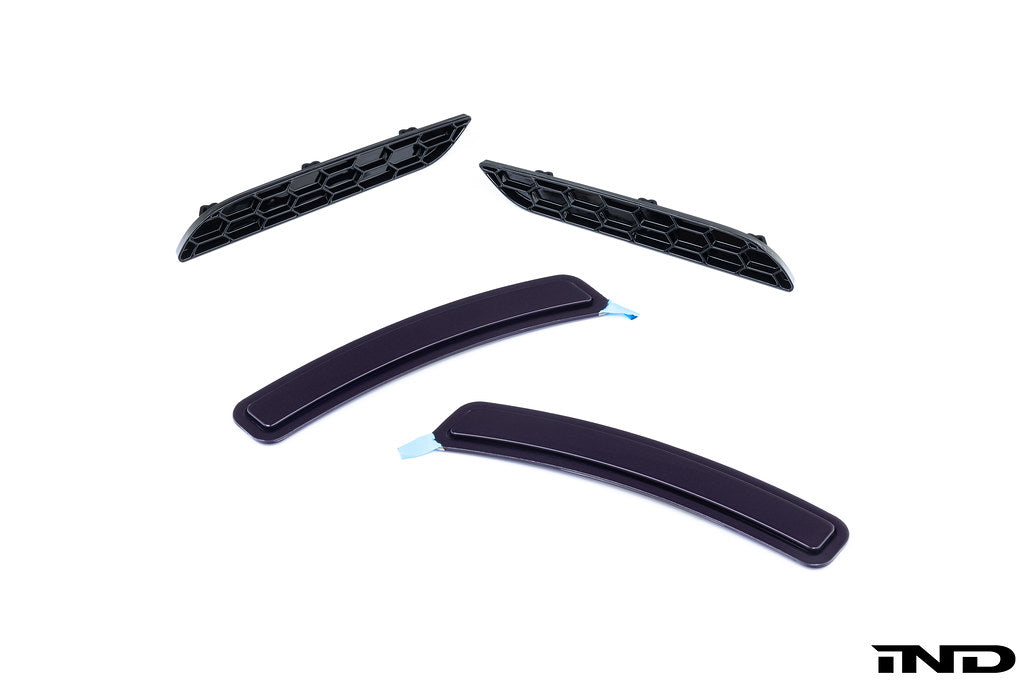 IND exterior G42 2-Series M-Sport reflector cosmetic package showing sleek, reflective car exterior component with detailed finish.