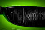 Eventuri black carbon air scoop set for BMW F8X M3 and M4 performance car, showcasing sleek aerodynamic design.