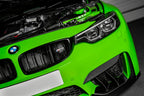 Eventuri BMW F8X M3 M4 black carbon air scoop set for performance enhancement, shown installed on vehicle engine bay