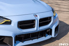 BMW M 50 Year Anniversary Heritage Roundel set on exterior of G87 M2, featuring classic BMW logo design on the car's surface