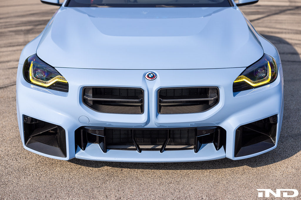 BMW M 50 Year Anniversary Heritage Roundel set on exterior of G87 M2, featuring commemorative badges on the car's body.