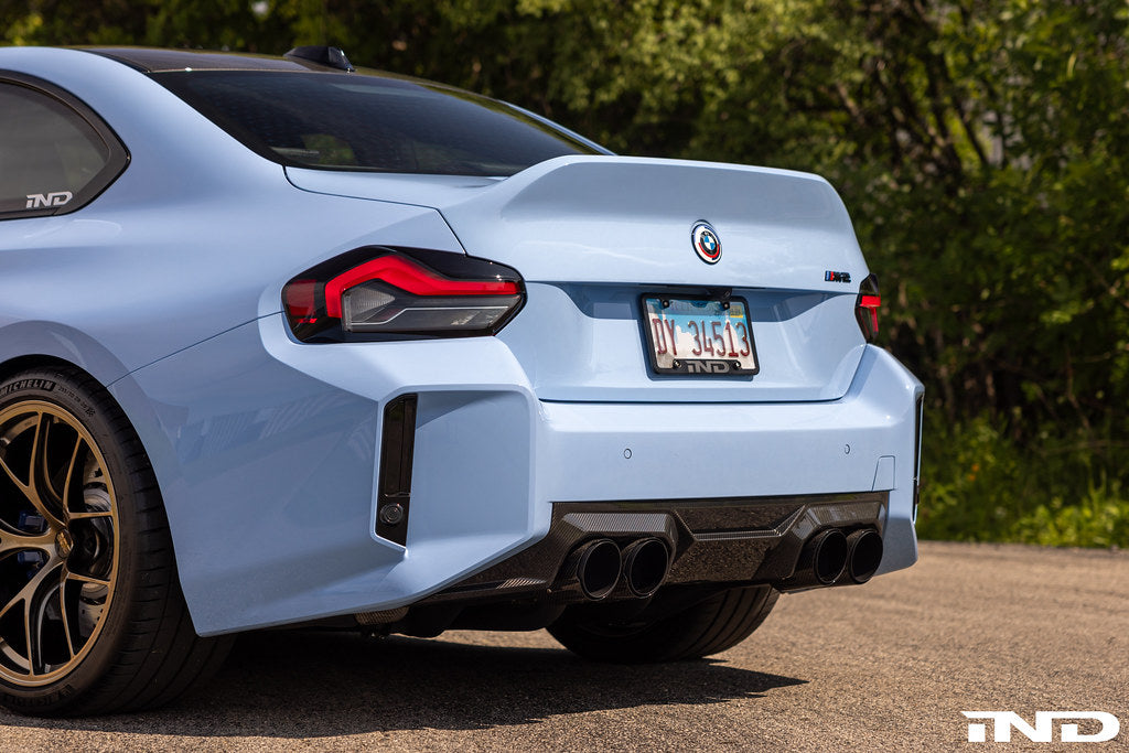 BMW M 50 Year Anniversary Heritage Roundel set on exterior of G87 M2, featuring commemorative M logo badges on the vehicle.