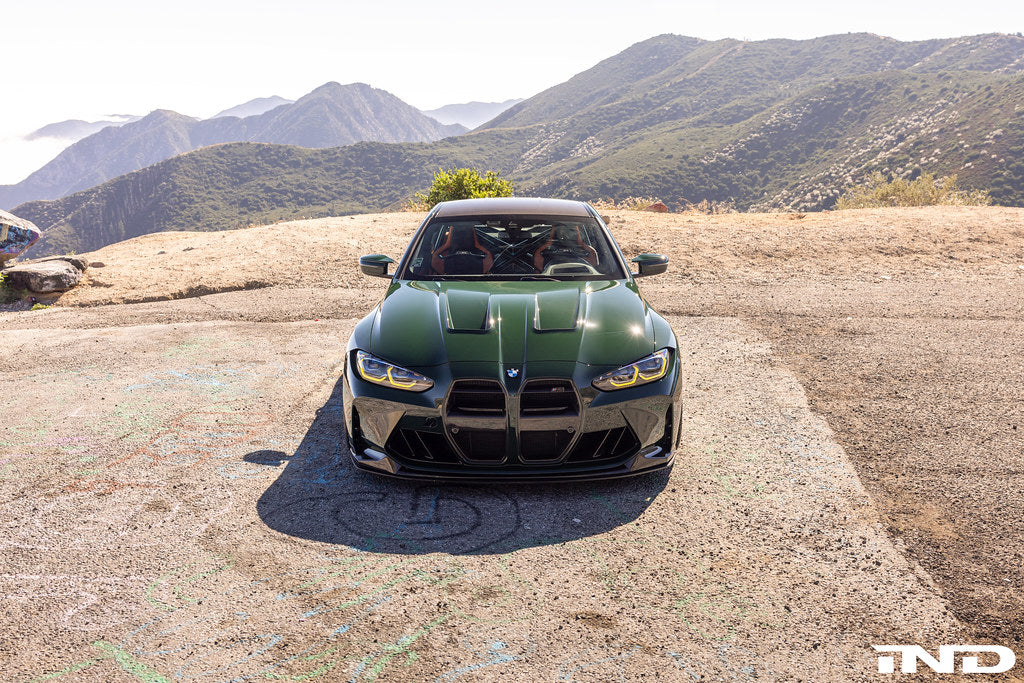 Alpha N Alpha-N G8X M3 M4 carbon vented hood on a car, showcasing lightweight exterior upgrade with vented design and sleek finish.