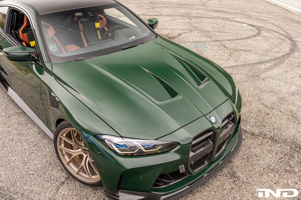 Alpha N G8X M3/M4 carbon vented hood exterior view, showcasing lightweight, high-performance automotive hood with venting features.