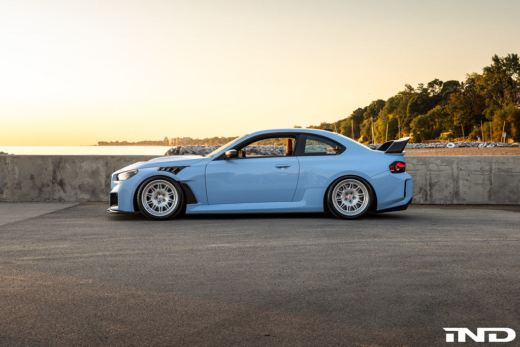 Alpha-N G87 M2 Carbon fixed rear wing mounted on a car, showcasing a sleek, aerodynamic exterior exterior accessory for enhanced performance.