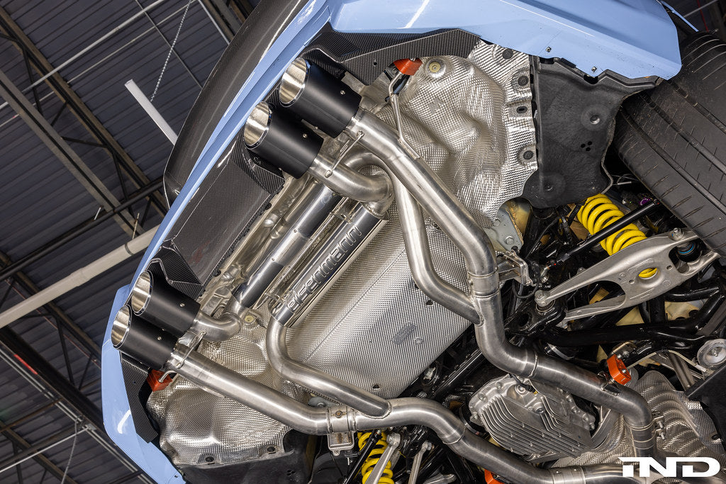 Eisenmann G87 M2 Twin-Flow exhaust system installed on a BMW M2, showcasing polished metal exhaust tips and sporty design