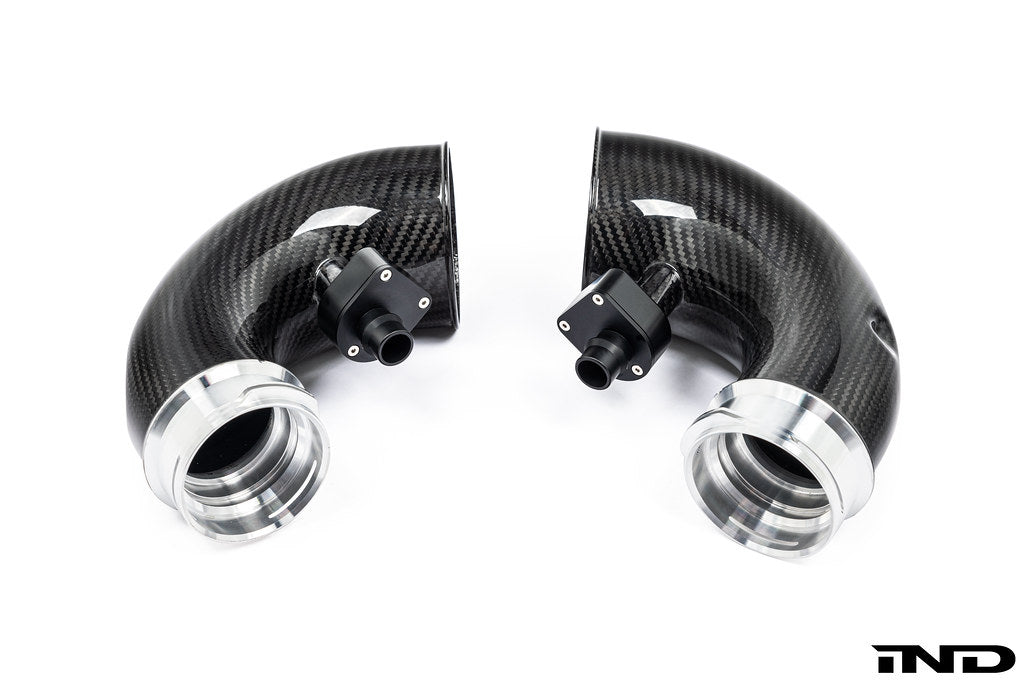 Eventuri F9X X5M X6M Pre-LCI carbon turbo inlet set showing sleek black carbon fiber with detailed inlet components.