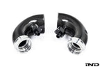Eventuri F9X X5M X6M Pre-LCI carbon turbo inlet set showing sleek black carbon fiber with detailed inlet components.