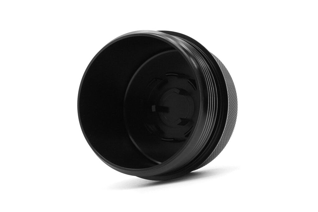 MMX Performance BMW S58 billet oil filter housing cap, high-performance engine component in metallic finish.
