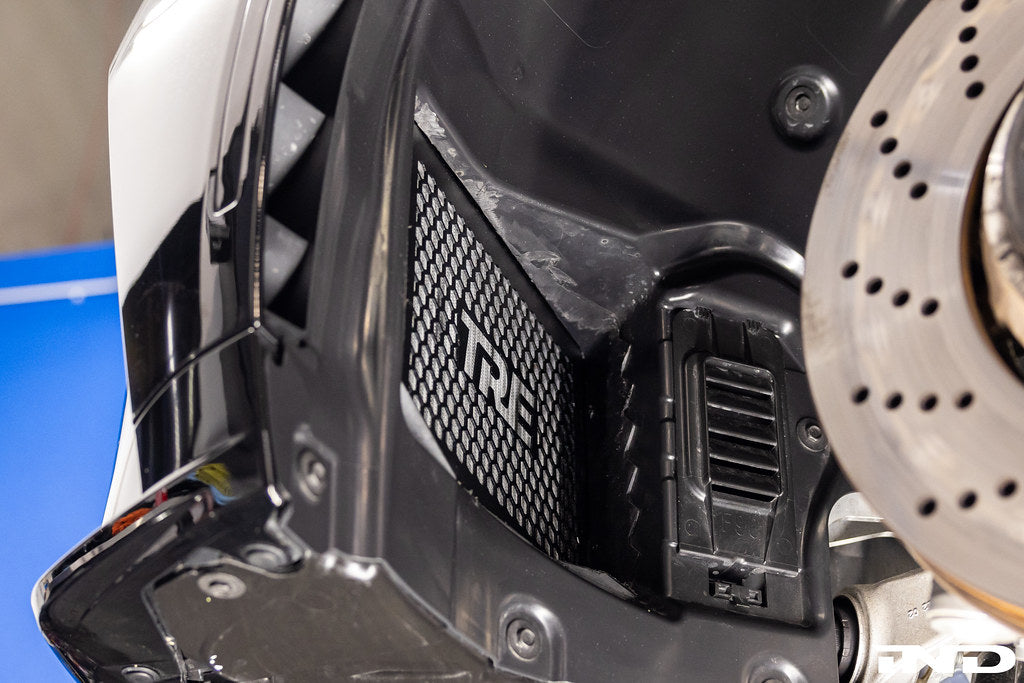 TREVORA G8X M2/M3/M4 exterior front non-rub arch clearance kit showing close-up of wheel arch and components