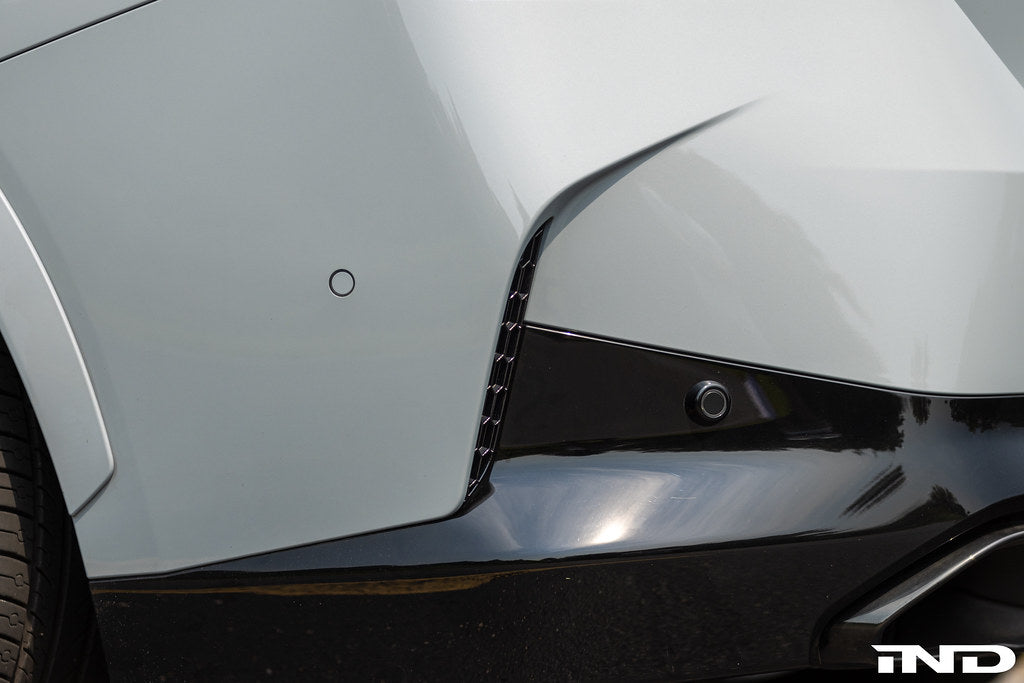 IND exterior G42 2-Series M-Sport reflector cosmetic package installed on a BMW G42, showcasing sleek design and reflective surfaces.