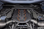 AutoTecknic G90 G99 M5 carbon engine cover extension set installed on car's exterior, showcasing sleek black carbon fiber finish.