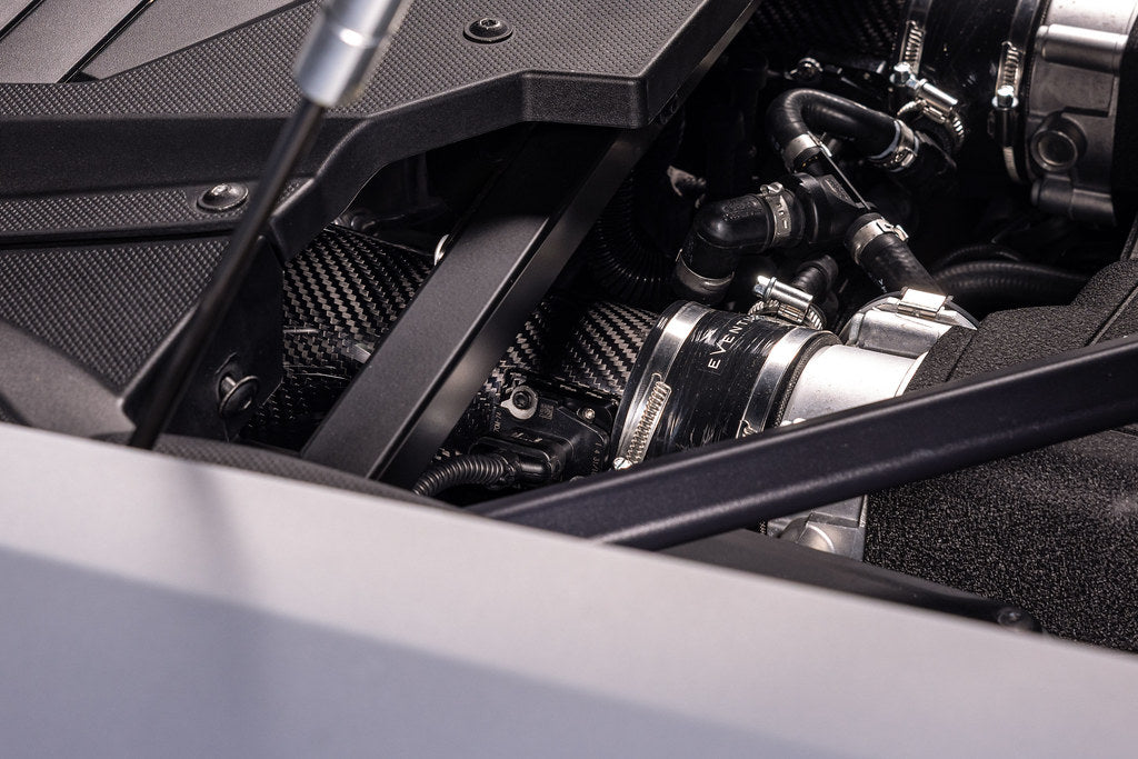 Eventuri Lamborghini Huracan EVO / STO black carbon intake system installed, showcasing sleek performance air intake design.
