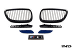 IND E9X M3 exterior cosmetic package with sleek body modifications and stylish accents on a dark-colored car.